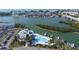 Breathtaking aerial view of the community's waterfront, pool, marina, boat slips, and lush landscaping at 11351 Shipwatch Ln # 1844, Largo, FL 33774