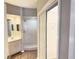 Hallway bathroom with shower, vanity, and walk-in closet at 11351 Shipwatch Ln # 1844, Largo, FL 33774