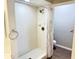 Clean, bright tiled shower and floors in the bathroom at 11351 Shipwatch Ln # 1844, Largo, FL 33774