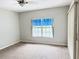 Bedroom with neutral carpet, a window with blinds and light gray walls at 11351 Shipwatch Ln # 1844, Largo, FL 33774