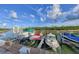 Boat docks on a sunny day, featuring several boats and a tranquil waterway at 11351 Shipwatch Ln # 1844, Largo, FL 33774