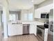 Bright, modern kitchen with stainless steel appliances, countertop space and an open layout at 11351 Shipwatch Ln # 1844, Largo, FL 33774
