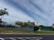 Exterior view of tennis courts, apartment building and racketball wall at 11351 Shipwatch Ln # 1844, Largo, FL 33774