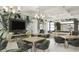 Features of the game room include ample seating, billiards, and TV at 11470 Myakka Blue Dr, Venice, FL 34293