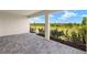 A brick patio with an inviting atmosphere and a serene, expansive view of the outdoors at 11470 Myakka Blue Dr, Venice, FL 34293