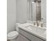 Bathroom featuring a single sink vanity with a mirror and a tiled shower at 11520 Myakka Blue Dr, Venice, FL 34293