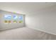 Spacious bedroom with plush carpet and large windows offering natural light at 11520 Myakka Blue Dr, Venice, FL 34293