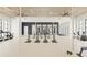 Well-equipped fitness center with treadmills, elliptical machines, mirrors, and an open floor plan at 11520 Myakka Blue Dr, Venice, FL 34293