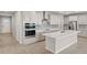 Well-equipped kitchen featuring an island, stainless steel appliances, and stylish cabinetry at 11520 Myakka Blue Dr, Venice, FL 34293