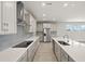 Open-concept kitchen with a large island, stainless steel appliances, and plenty of counter space at 11520 Myakka Blue Dr, Venice, FL 34293