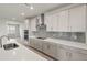 Contemporary kitchen featuring sleek countertops, a stylish backsplash, and modern appliances at 11520 Myakka Blue Dr, Venice, FL 34293