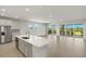 Spacious living room with tile floors, ample natural light, and access to the outdoor patio at 11520 Myakka Blue Dr, Venice, FL 34293