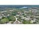 This aerial view highlights a neighborhood with greenery, residential streets, and a nearby water feature at 11940 Terra Ceia Ave, New Port Richey, FL 34654