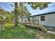 Backyard featuring a weathered wooden deck and partial fencing at 11940 Terra Ceia Ave, New Port Richey, FL 34654