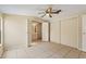 A cozy bedroom featuring tile floors and a spacious closet, ideal for comfortable living at 11940 Terra Ceia Ave, New Port Richey, FL 34654