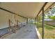 Attached carport showing access steps and ample covered parking at 11940 Terra Ceia Ave, New Port Richey, FL 34654