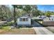This home has a spacious driveway, fenced yard, and a carport at 11940 Terra Ceia Ave, New Port Richey, FL 34654