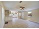 Bright, open-concept living area with tile flooring and abundant natural light at 11940 Terra Ceia Ave, New Port Richey, FL 34654