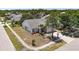 Aerial view of a well-maintained home with mature landscaping and a two-car garage at 12002 Peony Ct, Tampa, FL 33635
