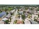 Expansive aerial view of a quiet neighborhood with tree-lined streets and waterfront homes at 12002 Peony Ct, Tampa, FL 33635