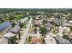 Expansive aerial view of a quiet neighborhood with tree-lined streets and waterfront homes at 12002 Peony Ct, Tampa, FL 33635