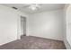 Cozy bedroom with a ceiling fan and closet at 12002 Peony Ct, Tampa, FL 33635