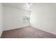 Light-filled bedroom with a large window and neutral carpeting at 12002 Peony Ct, Tampa, FL 33635