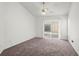 Spacious bedroom with sliding glass doors to the outside at 12002 Peony Ct, Tampa, FL 33635