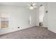 Bright bedroom with dual windows and an ensuite bathroom at 12002 Peony Ct, Tampa, FL 33635