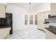 Bright eat-in kitchen featuring a corner window and tile floors at 12002 Peony Ct, Tampa, FL 33635