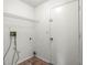 Functional laundry room with a utility sink and shelving at 12002 Peony Ct, Tampa, FL 33635