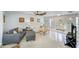 Inviting living room featuring terrazzo floors, stylish furniture, and a welcoming atmosphere at 127 Lake Judy Lee Dr, Largo, FL 33771