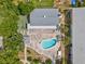 Aerial view of pool and tennis courts in a well-maintained community at 128 Brandy Wine Dr, Largo, FL 33771