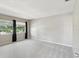This spacious bedroom is filled with light from two large windows and features plush carpeting and neutral walls at 128 Brandy Wine Dr, Largo, FL 33771
