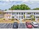 Charming two-story condo features well-maintained landscaping, ample parking, and convenient access at 128 Brandy Wine Dr, Largo, FL 33771