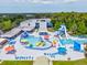 Community pool and recreation center featuring slides, splash pads, and lounge areas for residents to enjoy at 128 Brandy Wine Dr, Largo, FL 33771