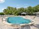 The beautiful community pool features lounge seating and is perfect for hot summer days at 128 Brandy Wine Dr, Largo, FL 33771
