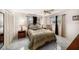 Cozy bedroom with tile floors, a ceiling fan, and windows at 12848 137Th Ln, Largo, FL 33774