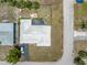 Aerial view of the property showcasing the house, driveway, and surrounding lot boundaries at 1301 62Nd S Ter, St Petersburg, FL 33705