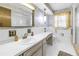 Bright bathroom featuring a shower and vanity with ample counter space at 1301 62Nd S Ter, St Petersburg, FL 33705