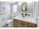 Bathroom features a sink, toilet, and wallpaper at 1301 62Nd S Ter, St Petersburg, FL 33705