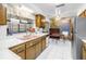 Functional kitchen with stainless steel appliances, tile flooring, and ample counter space at 1301 62Nd S Ter, St Petersburg, FL 33705