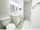 Bathroom with a white vanity, framed mirror, and updated fixtures at 13018 Clay Ave, Largo, FL 33773
