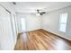 Bedroom featuring new floors, good natural light, and access to the yard at 13018 Clay Ave, Largo, FL 33773