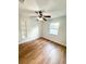 Bedroom featuring new floors, updated ceiling fan, and good natural light at 13018 Clay Ave, Largo, FL 33773