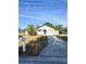 Charming single-story home featuring a well-maintained front yard and attached garage in a residential neighborhood at 13018 Clay Ave, Largo, FL 33773