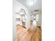 Open concept view of kitchen with stainless appliances flowing into an open floor plan at 13018 Clay Ave, Largo, FL 33773