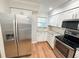 Kitchen featuring stainless steel appliances, granite countertops, and bright cabinetry at 13018 Clay Ave, Largo, FL 33773