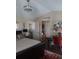 Spacious bedroom with a unique chandelier, decor, and natural light at 13020 Lorna Pl, Tampa, FL 33618