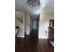 Entryway with staircase, hardwood floors, and decorative chandelier at 13020 Lorna Pl, Tampa, FL 33618